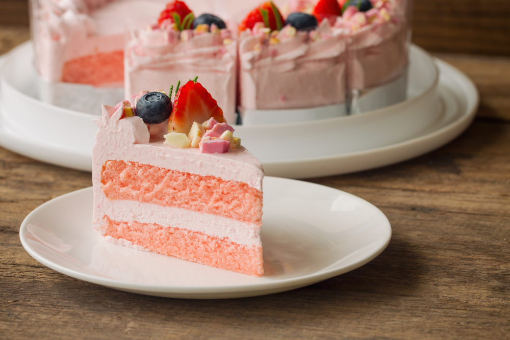 Strawberry cake slice with berries.